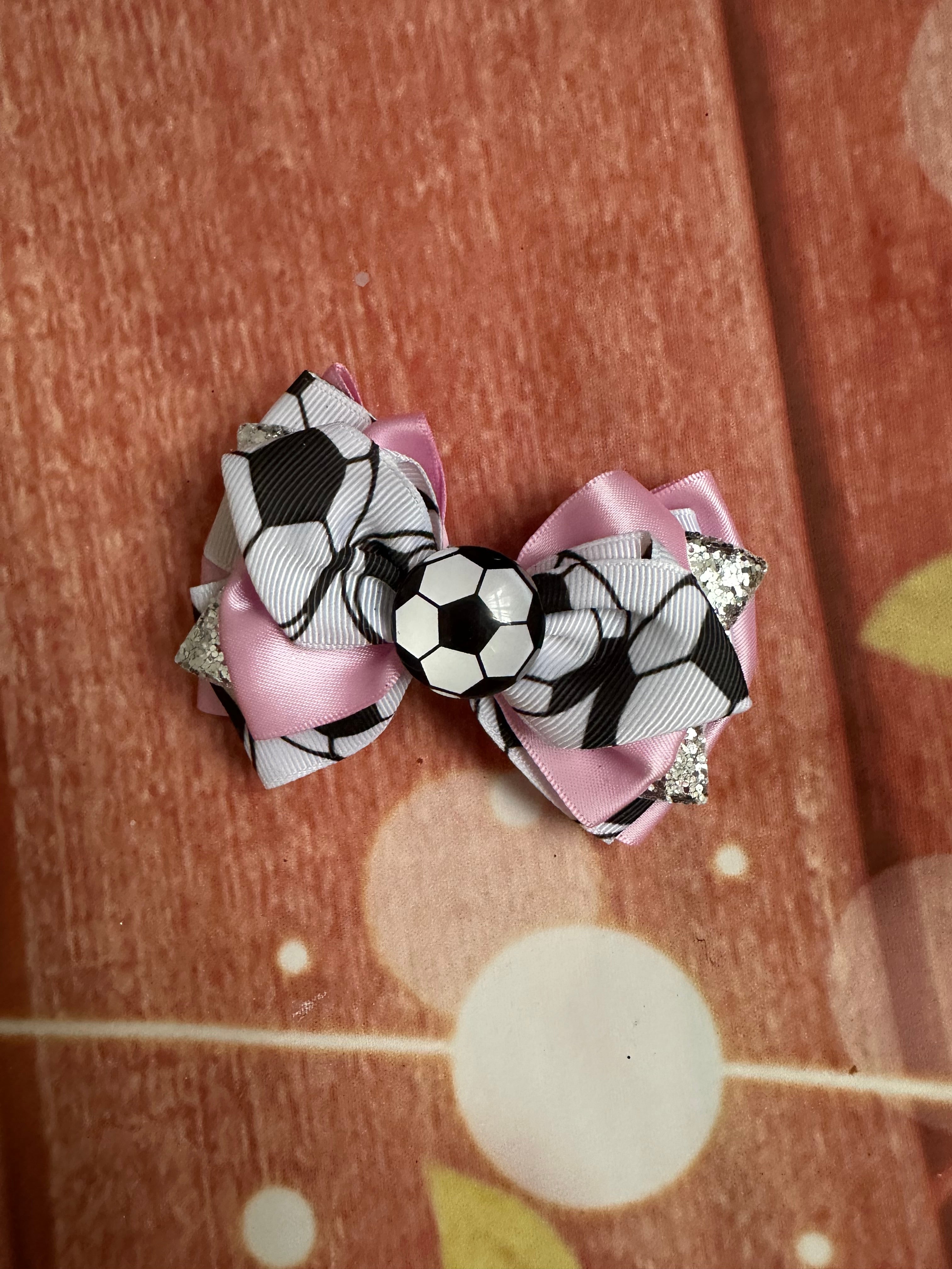 Pink soccer piggy bow
