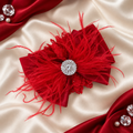 Red satin bow with feathers