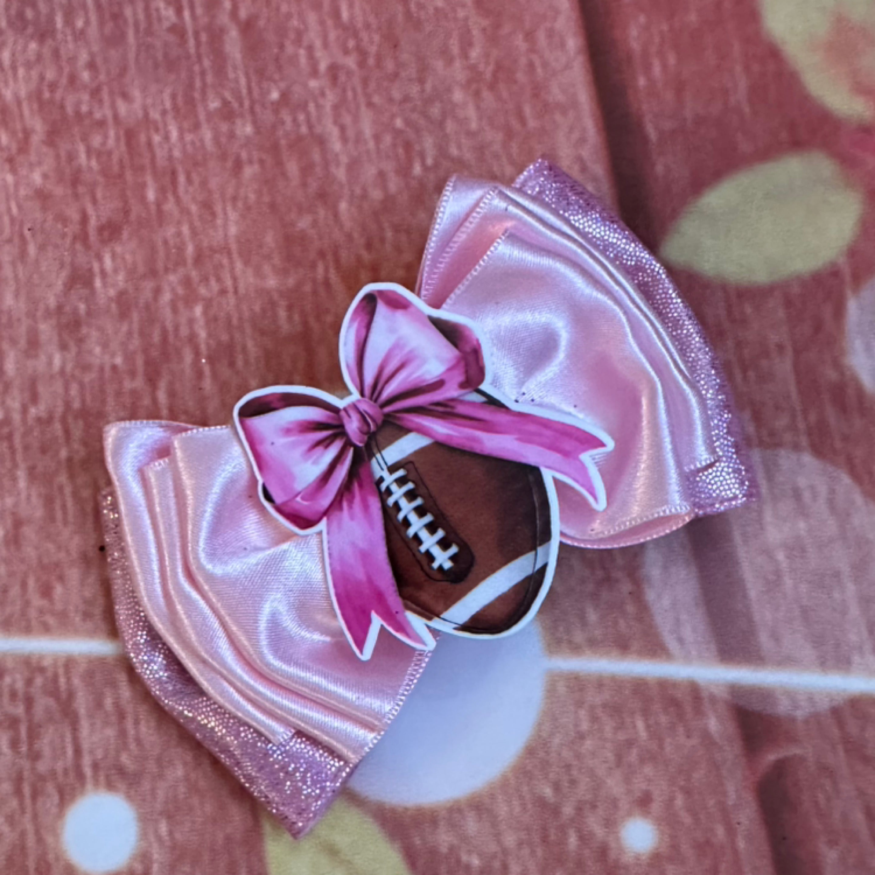 Pink football piggy clip